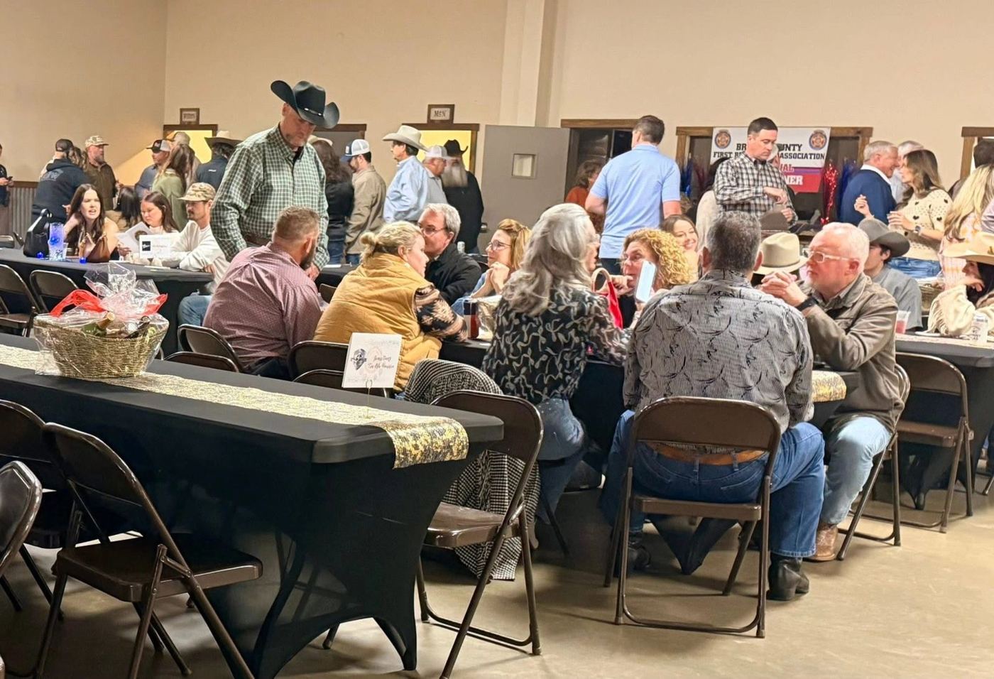 Long tables full of guests at dinner